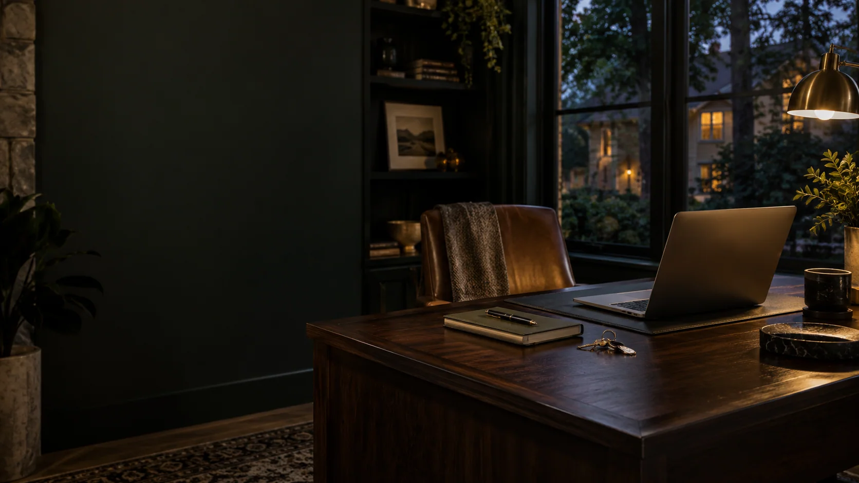 Illustrative quiet home study with a laptop, notebook and house keys